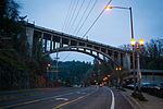 Arch bridge at night from below