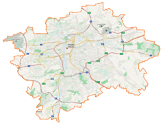 Mapa konturowa Pragi, w centrum znajduje się punkt z opisem „Cmentarz Prawosławny (Olšany)”