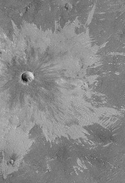 Bright rays caused by impact throwing out a bright lower layer. Some bright layers contain hydrated minerals. Picture taken with Mars Global Surveyor, under the MOC Public Targeting Program.