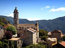 A view of the village and the parish church of the Annunciation, in Sermano