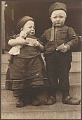 Dutch siblings from the Island of Marken, holding religious tracts