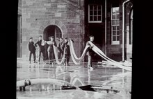 Greenock fire crew with hose during training drill.