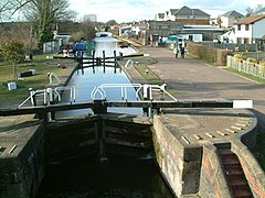 A lock and upstream tract to a white humpback bridge at Apsley, Hertfordshire