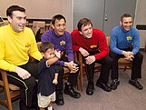 Four of the original Wiggles and a fan