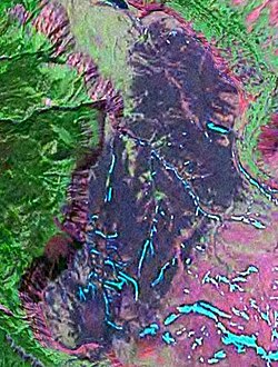 False colour image of the Kitsu Plateau; the cliff forming the western edge of the plateau is the southern portion of the Mess Creek Escarpment