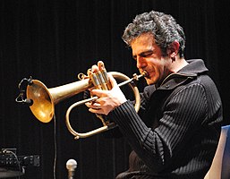 Paolo Fresu playing a flugelhorn onstage