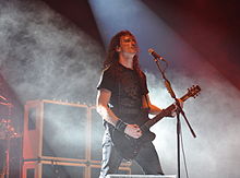 Joe Duplantier playing a guitar in 2013