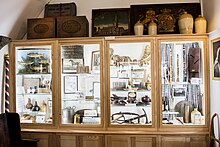 Display cabinet at the Burford Tolsey Museum with items of Burford's trades and crafts