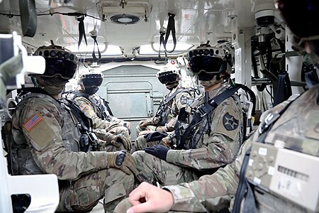 Soldiers equipped with IVAS inside a Stryker