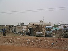 shanty town by dusty road