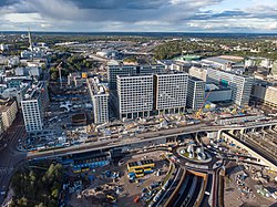 Pasila from the air in 2019. Pasila railway station is surrounded by office buildings and the Mall of Tripla, built in 2019.