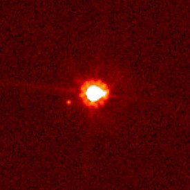 Eris (center) and Dysnomia (left of center), taken by the Hubble Space Telescope.