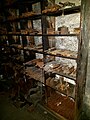 A shelf with rusty blades.