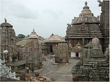 Image of a conical temple tower with smaller shrines around it.