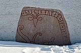 Runestone immured in the church porch