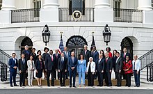 Group photo of Biden, Harris and cabinet members standing outdoors