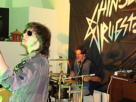 Marco S. Soccol (left) and Lorenzo Gualandris (right) performing with The Apes in the Marche region of Italy