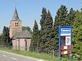 Place name sign of Dodewaard in front of the church of Hien