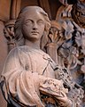 Female statue carved from red sandstone on Grayfriars Church, Dumfries