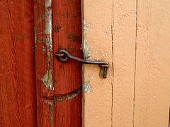 A cabin hook used as a latch for a wooden gate