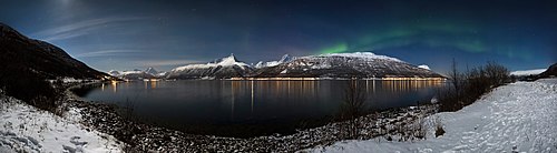 Aurora borealis above Storfjorden and the Lyngen Alps in moonlight, 2012 March