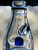 Marble stopper (blue) in a bottle