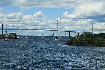 Narragansett Bay is a bay and estuary on the north side of Rhode Island Sound covering 147 mi2 (380 km2). It forms New England's largest estuary, which functions as an expansive natural harbor and includes a small archipelago.