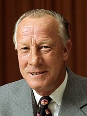 Colour portrait photo of a man wearing a suit