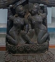 Wooden figurines of his wives, Padmavati and Chandravati.