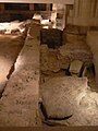 Right wall of the baths, bordered by the sarcophagi of the Merovingian necropolis.