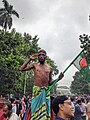 A rickshaw puller saluting the protesters