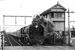H 220 leads the Albury Express out of Melbourne, past the signalbox at Essendon, circa 1949