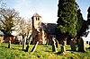 A small chapel with a tower surmounted by a pyramidal roof