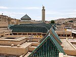 Rooftop view of the Kissaria in 2023, after recent renovations, with sloped wooden roofs covered in green tiles