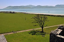 Photo of the view across a body of water towards a hilly island