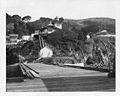 View from pier looking ashore and up at light station – U.S. Coast Guard Archive