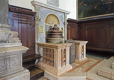   Baptismal font, on the inside of the front, left.