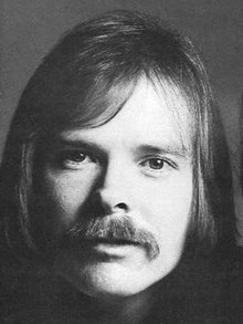 A black-and-white headshot of Dan Seals