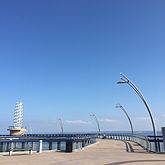 The wallkway and the beacon from the pier