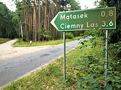 A fingerpost pointing to the village