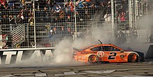 a driver performs doughnuts in their car