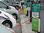 Several plug-in electric vehicles recharging at San Francisco City Hall public charging station.