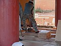 Craftsmen assemble flooring planks in a temple hall