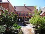 The Old Longmarket Street Girls' School is a double storey building of considerable character design. The Longmarket Street Girls' School building was erected between 1903 and 1911. The building shows a plurality or architectural styles and is a fine and rare example of a Victorian school building. Architectural style: Nineteenth century Classical revival style. Type of site: School Previous use: school. Current use: museum. Head down Longmarket St (one-way) and turn into parking lot for Vorrtrekker Museum on left just before. The Longmarket Street Girls' School building was erected between 1903 and 1911. The building shows a plurality or architectural styles and is a fine and rare example of a Victorian school building.