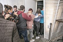 People entering the BlackOut dark restaurant