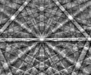 An electron backscatter diffraction pattern of monocrystalline silicon, taken at 20 kV with a field-emission electron source. The Kikuchi bands intersect at the centre of the image