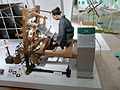 Weaving tsumugi cloth at a jibata (low loom), later largely replaced by takahata (high looms).[11]