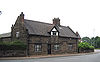 A low stone single-storey house with a dormer