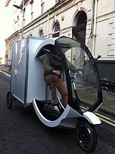 A modern cargo trike in use in London, featuring electric assist
