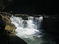 Image 55NgafaKhong (native Marma term) or Nafa-khum waterfall is situated on the Remaikree River, a tributory of Sangu river. The wild hilly Remaikree river suddenly falls down here about 25–30 feet. The falls are located in a remote area two hours' walking distance from Remakree bazar, Thanchi Upazila, Bandarban District. Photo Credit: Abu Md. Jakaria